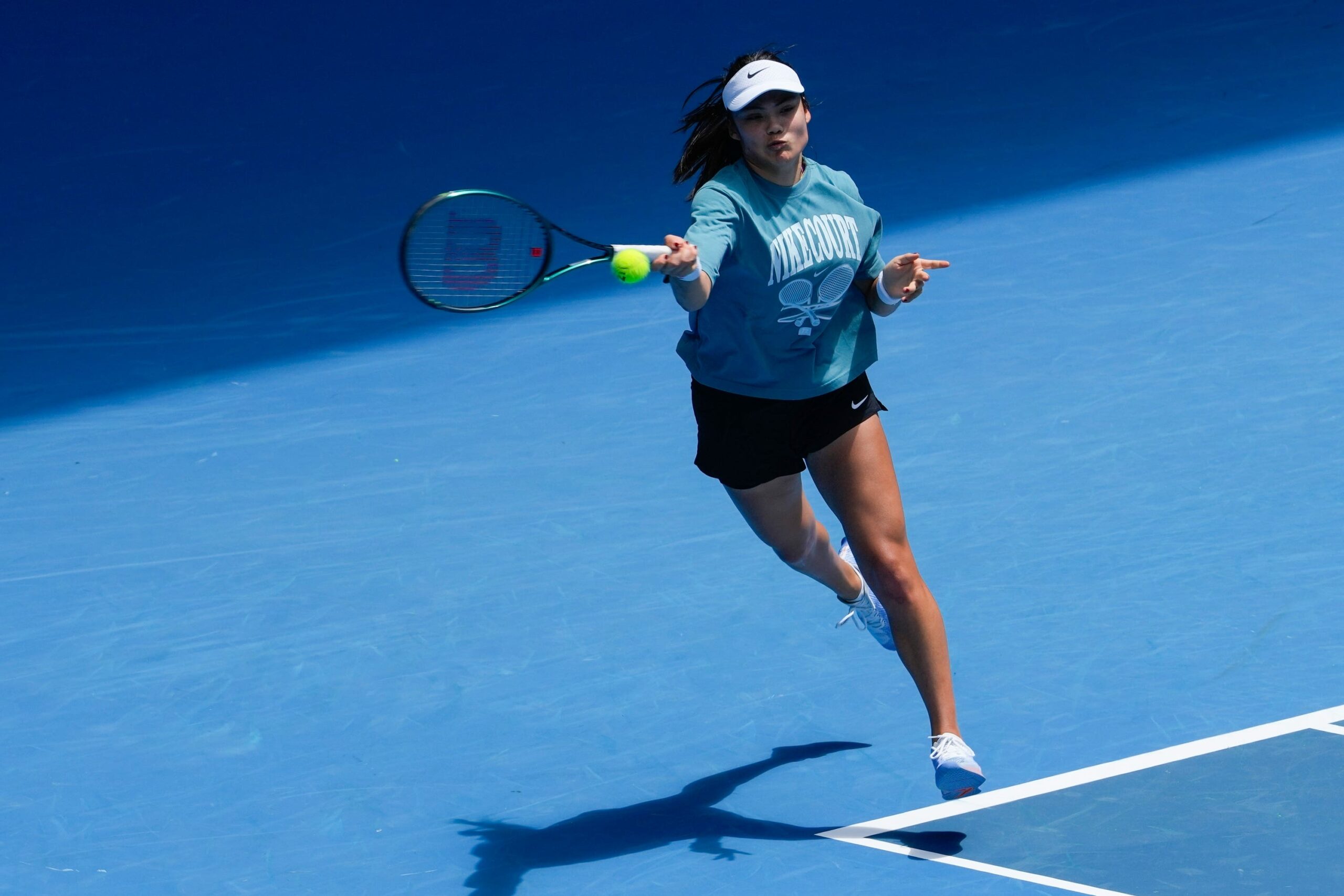 Emma Raducanu plays a forehand during a practice session